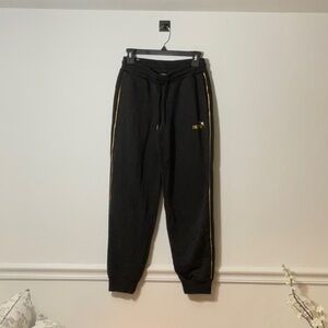 Puma Black Pants with Gold Detailing
